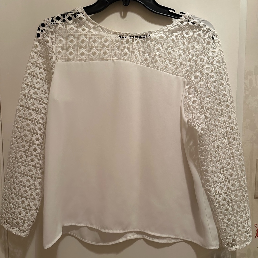White long sleeve blouse with cut out design on sleeves. From Zara in Paris NWT